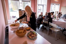 A volunteer grabbing food during the Animal Rights volunteers party