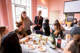 A volunteer picks up a card for the quiz during the Animal Rights volunteers party
