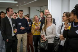 The audience applauds after a speech during the Stellenbosch University cocktail at the South African Embassy, Brussels