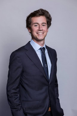 Corporate portrait of a young man wearing suit and tie in Brussels