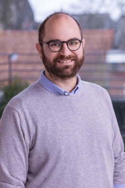Portrait of a man wearing a gray pullover for ECOS in Brussels