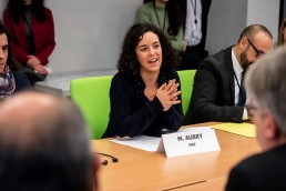 MEP Manon Aubry speaks and smiles during the Constitutive meeting of the Social Economy Intergroup