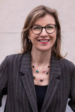 Portrait of Birgitta Bechtold wearing a gray jacket at Leopold Park, Brussels
