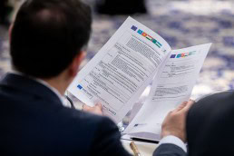 Closeup of the program hold by a participant during the 9th meeting of the WGECC in Brussels