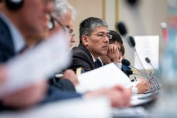 Closeup of a man who listens to the presentations during the 9th meeting of the WGECC in Brussels