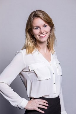 Corporate portrait of a blond woman wearing a white shirt for Berquin Notarissen in Brussels	