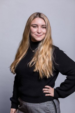 Corporate portrait of a woman wearing a black sweater for Berquin Notarissen in Brussels	