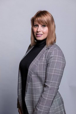 Corporate portrait of a woman wearing a gray jacket for Berquin Notarissen in Brussels	