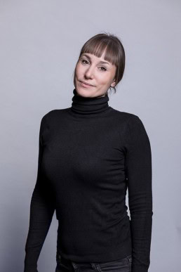 Corporate portrait of a woman wearing a high neck black sweater for Berquin Notarissen in Brussels	