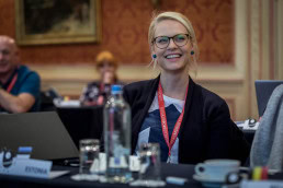 A blond woman wearing glasses smiles during the 2019 European Mobility Week in Brussels