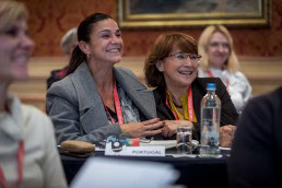 Two brunette women smile during the 2019 European Mobility Week conference in Brussels