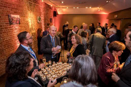 People enjoying a networking drink after an award ceremony event in Brussels
