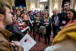 A group of people gather in circle while doing a workshop during the 2019 European Mobility Week in Brussels
