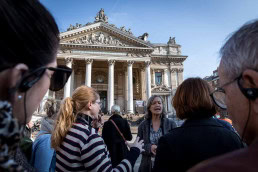A group follows a walking tour in front of La Bourse in Brussels for the 2019 European Mobility Week