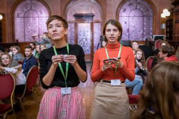 Two girls observing a screen during the Skills for the Future event in Brussels