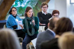 A woman poses a question during a conference for Missing Children Europe in Brussels
