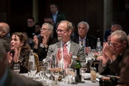 A man in the audience applauding during the 2019 Excellence in Road Safety Awards in Brussels