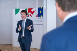 A man presenting Michel Sponar at a lecture