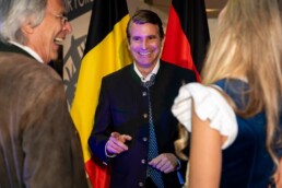 Eric Beißwenger smiling and talking to other people