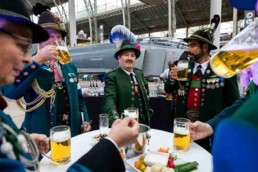 Men in Bavarian customs drinking beers