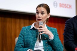 Aude Jalabaert speaking with a microphone during a discussion panel during the Industrial Single Market event organized by Bosch in Brussels