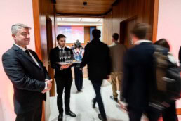 People walking towards a room during an event