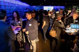 A room full of people talking and engaging in conversation during the NYC Tourism Convention in Brussels