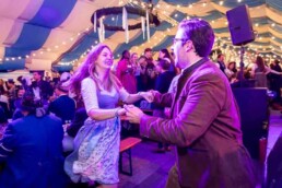 A woman and a man dancing together during the Brussels Oktoberfest 2025