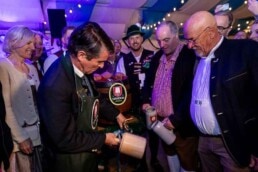 Eric Beißwenger opening the beer barrel during the Brussels Oktoberfest 2025