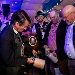 Eric Beißwenger opening the beer barrel during the Brussels Oktoberfest 2025