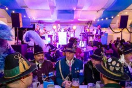 A group of men dressed with typical Bavarian outfits during the Brussels Oktoberfest 2025