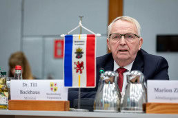 Dr. Till Backhaus speaking at a conference in Brussels 2025