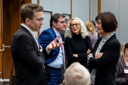 People discussing during a lunch break at a conference in Brussels 2025