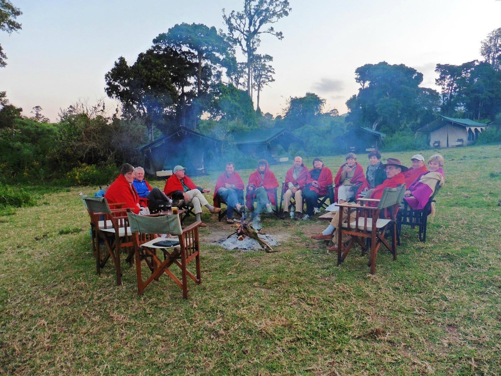 Gathering around a fire pit after a game drive through the crater