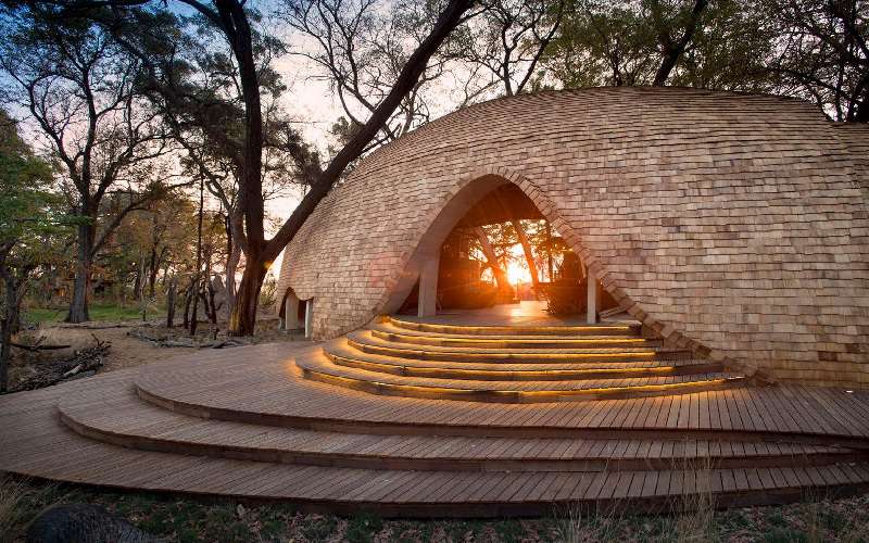 Luxury lodge in the Okavango Delta, Botswana | Photo credits: Cosy fireplace at a luxury lodge in Botswana | Photo credits: Sandibe Okavango Safari Lodge