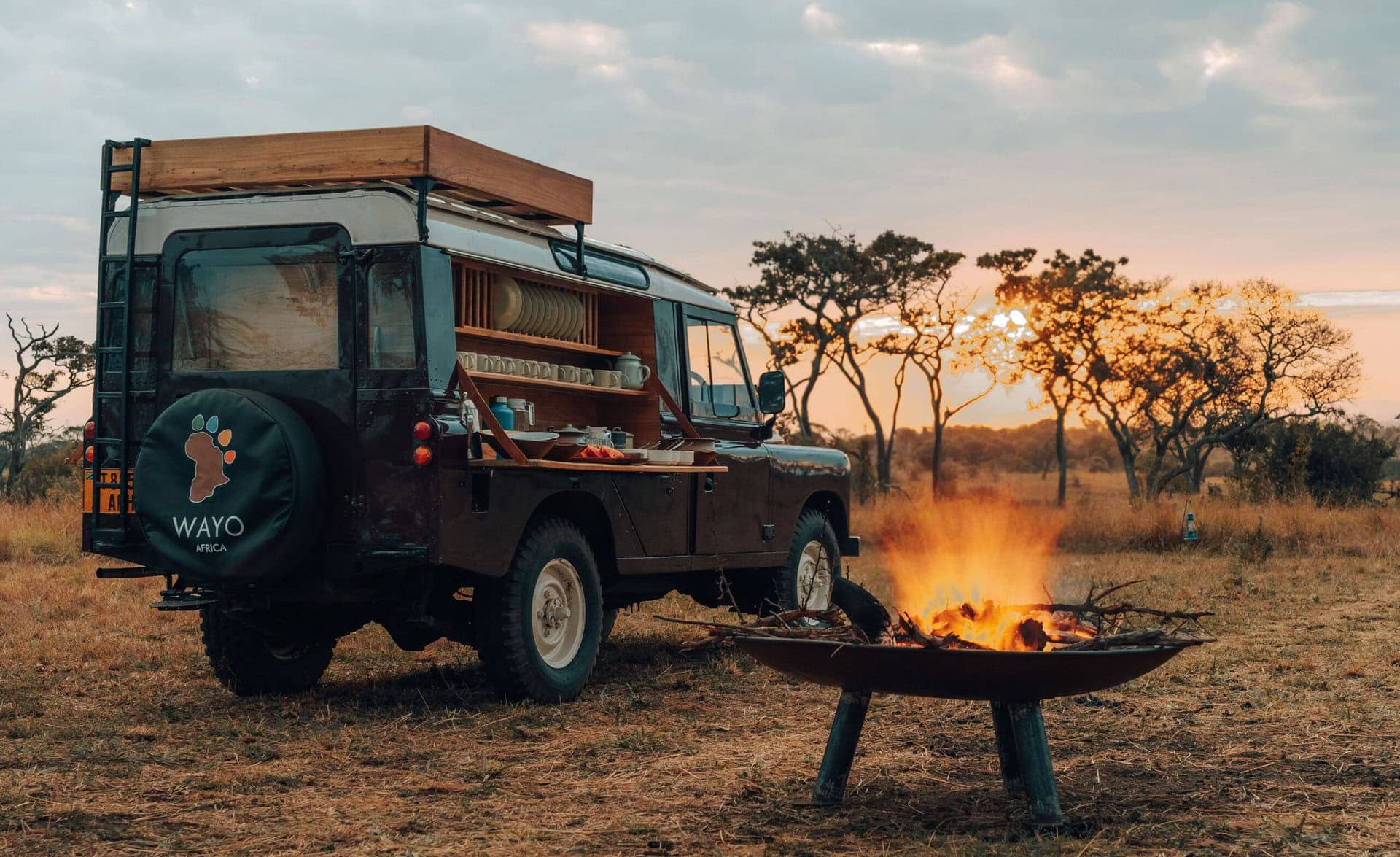 Sundowners at sunset in the Serengeti. One of the most iconic national parks in Africa.