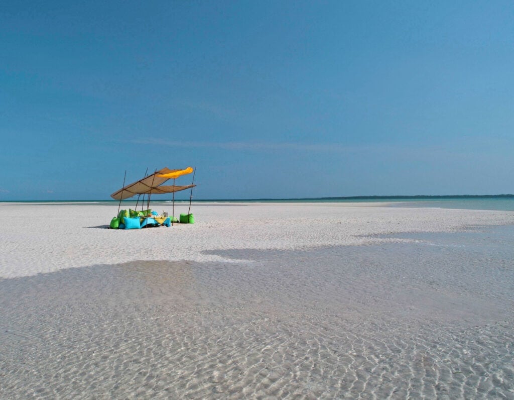 Seating on a sandbank at Funzi Keys, Kenya | Photo credit: Funzi Keys