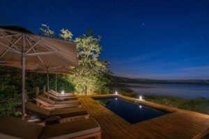 Loungers overlooking a look at night in Rwanda