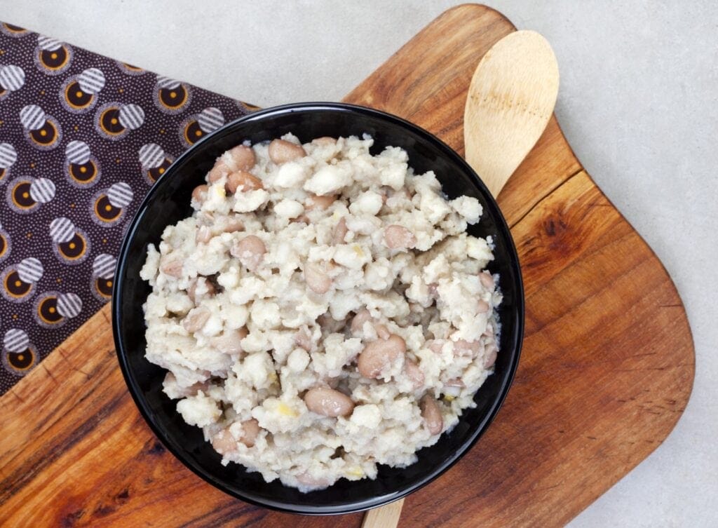 A type pf South African Food. Bowl of samp and beans on a wooden platter. Photo: Getty Images