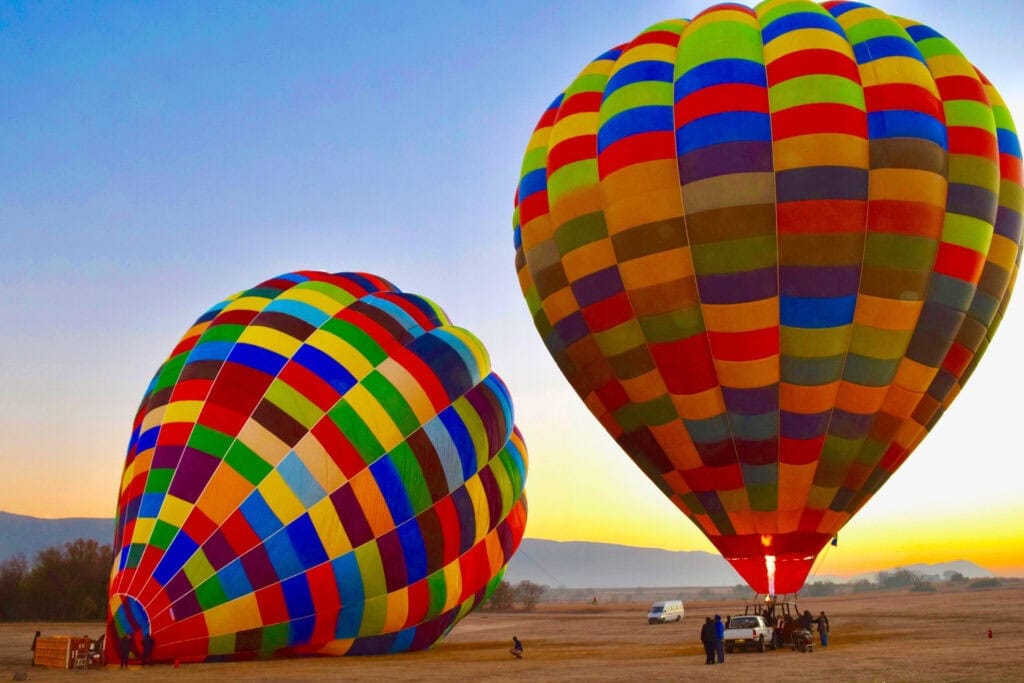 Hot air balloons being filled at dawn in South Africa. Photo: Getty Images