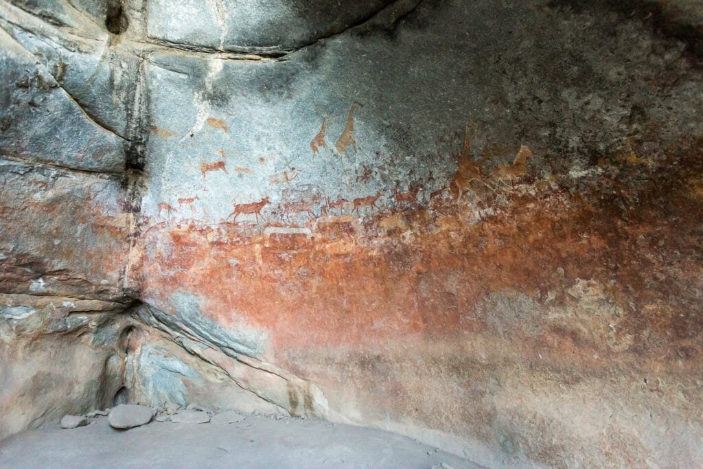 Stone age prehistoric animals carvings in the cave Matobo Hills, Zimbabwe. Photo: Getty Images