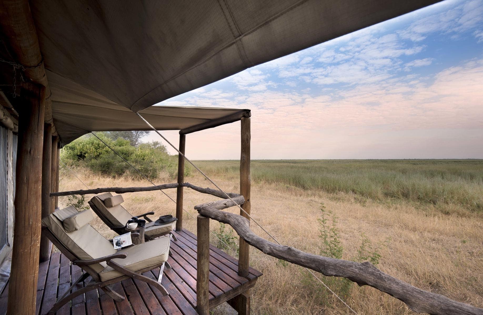 two deck chairs overlooking the bush on a deck