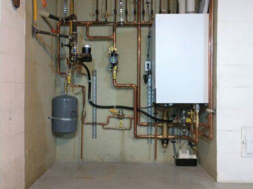 Complex HVAC piping and plumbing system with boiler and control units.