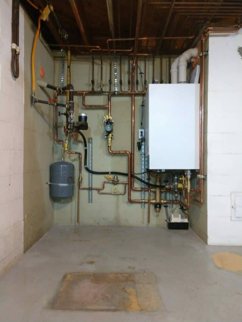 Complex HVAC piping and plumbing system with boiler and control units.