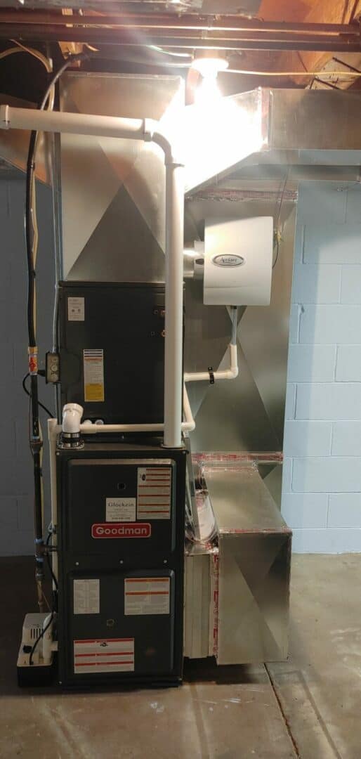 HVAC furnace with ductwork and air filtration system in basement.