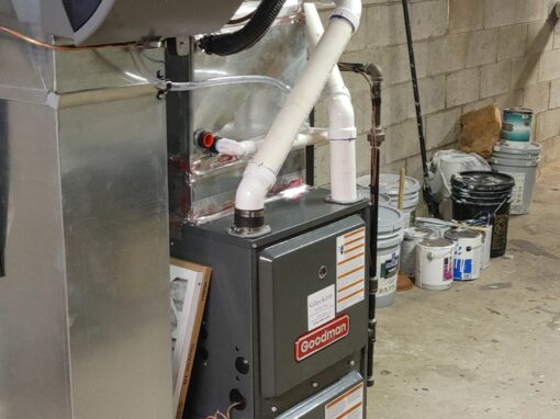 HVAC furnace and ductwork in a basement setting.