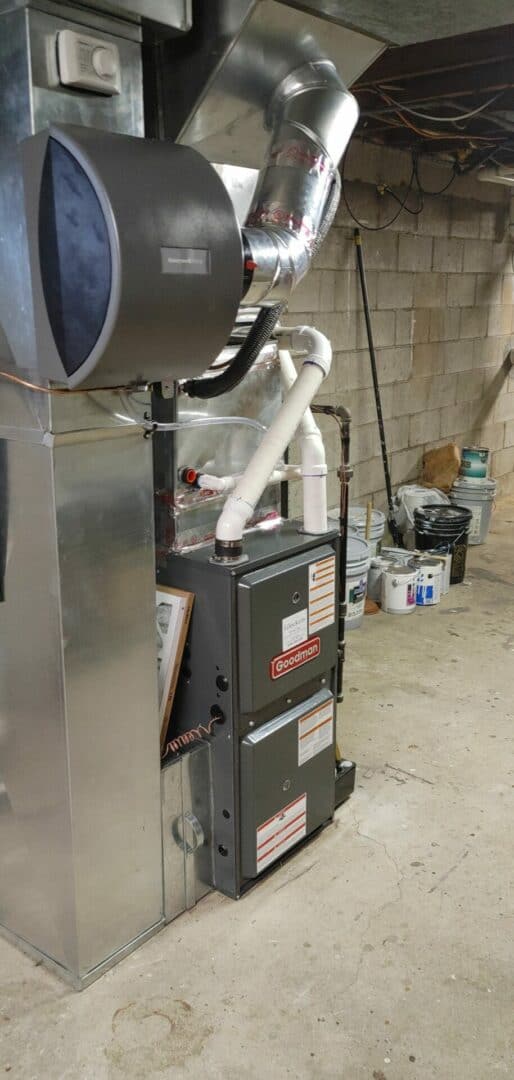HVAC furnace and ductwork in a basement setting.
