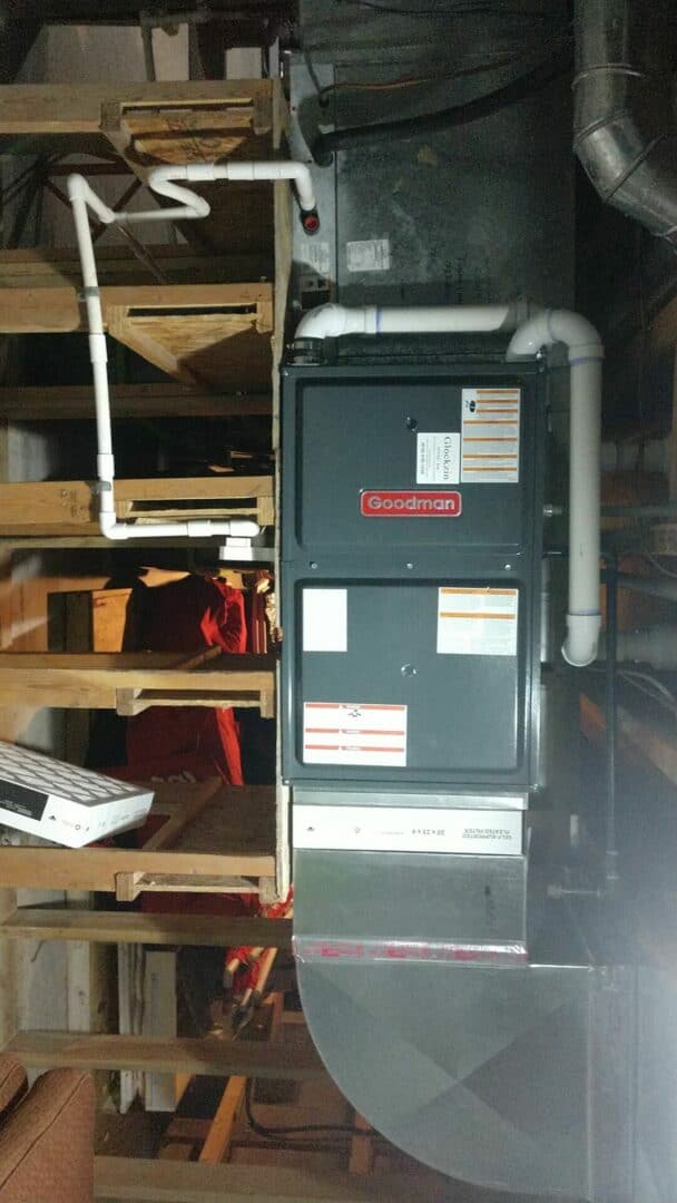 HVAC furnace and ductwork in a basement setting.
