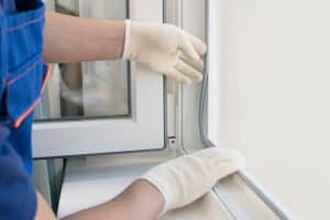 Replacing worn weatherstripping around a home window
