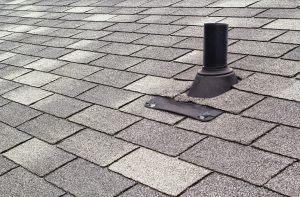 a vent pipe protected by shingles